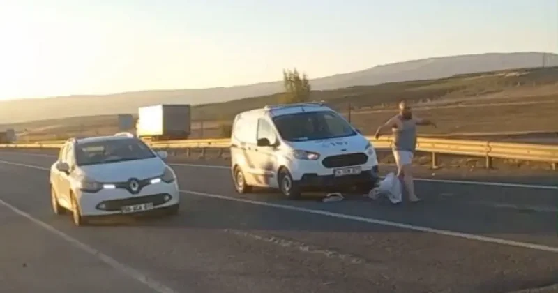 Trafiği birbirine kattı, araçların üzerine atladı, cam kırdı