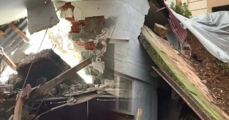 Çöken istinat duvarı binaya zarar verdi!