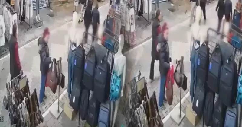 Yanından geçenlere de aldırış etmedi! Mağaza önünden hırsızlık kamerada