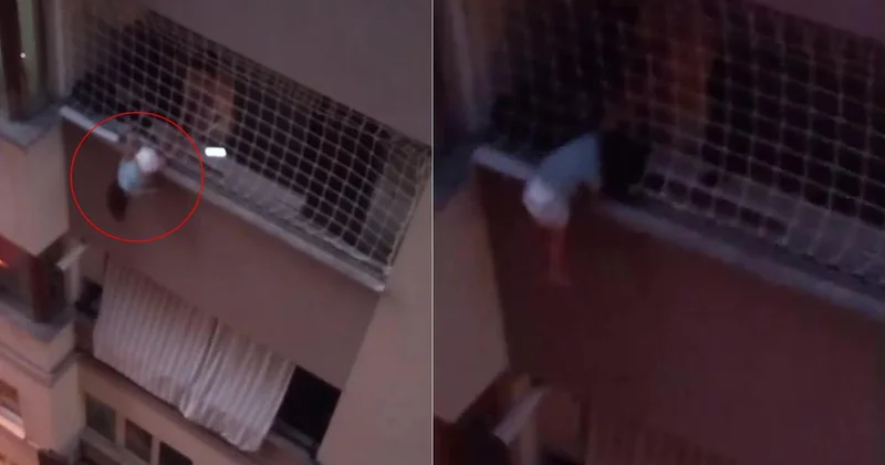 Balkonda asılı kalan çocuğu itfaiye kurtardı