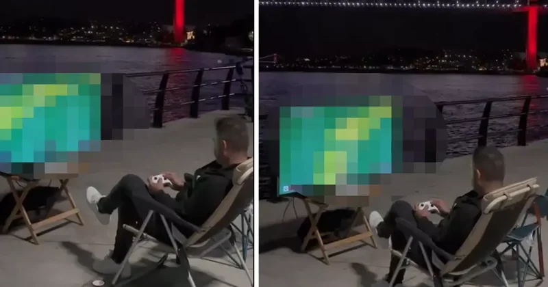 Köprü ve boğaz manzarasına karşı konsol oynadı