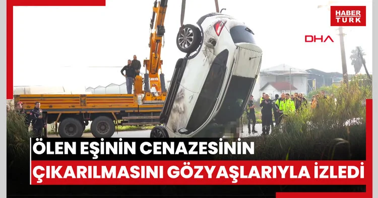 Kanala uçan cipte ölen eşinin cenazesinin çıkarılmasını gözyaşlarıyla izledi