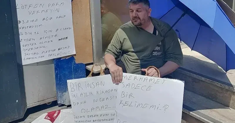 Evden çıkarılan kalp hastası kiracıdan Benim kalbim hasta, senin vicdanın yazılı pankartla eylem