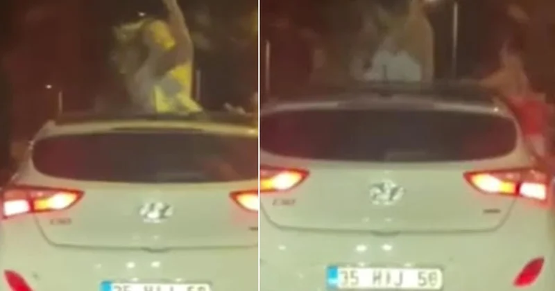 Karabük te iki kadının araç tavanından sarkıp dans ettiği anlar kameraya yansıdı