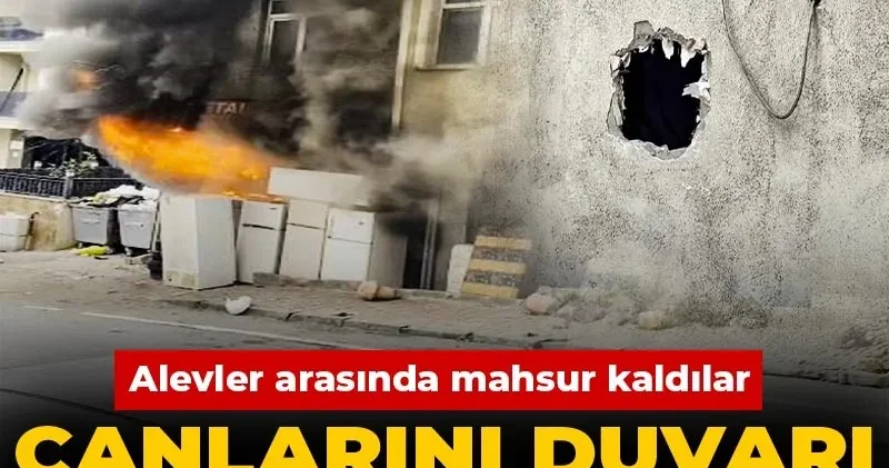 Alevler arasında mahsur kaldılar: Canlarını duvarı delerek kurtardılar!