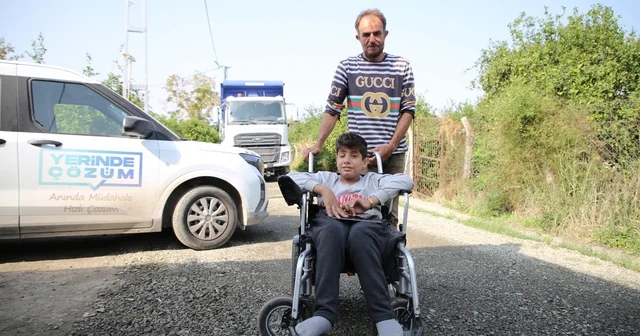 Tekerlekli sandalyesiyle rahat gezebilmesi için sokak asfaltlandı Hatay Haberleri