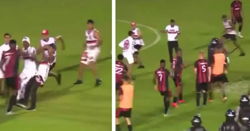 Taraftarlar sahaya girip futbolcularla yumruk yumruğa kavga etti