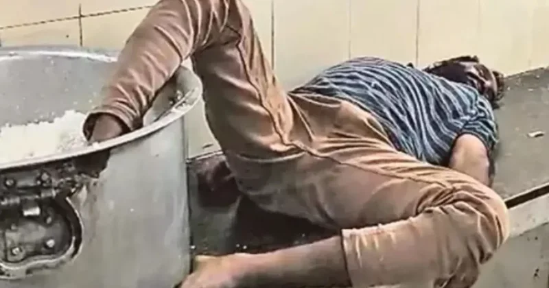 Öğrenci yurdunda çalışan sarhoş bekçi ayağı pirinç kazanı içinde uyurken yakalandı