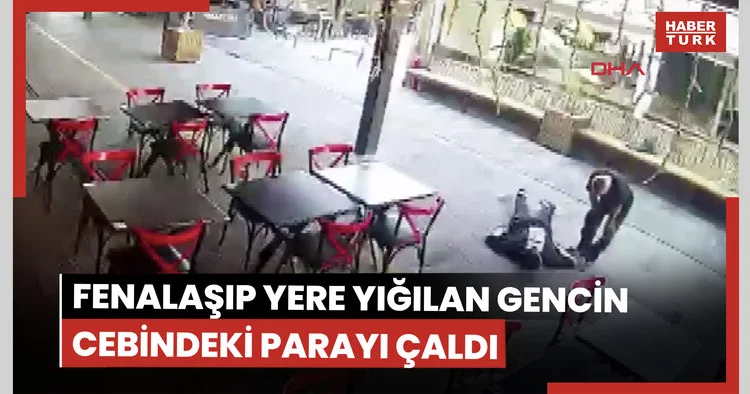 Fenalaşıp yere yığılan gencin cebindeki parayı çaldı; o anlar kamerada