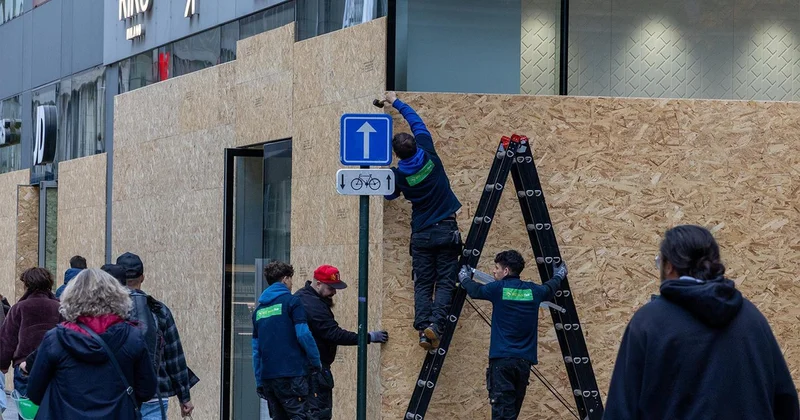 Brüksel de esnafı yağma korkusu sardı! Vitrinleri tahtalarla kapattılar