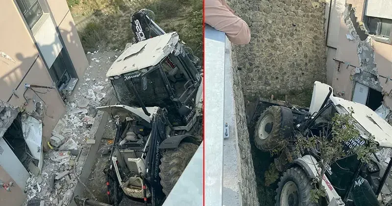 İş makinesi binaya çarpıp devrildi: operatör yaralandı
