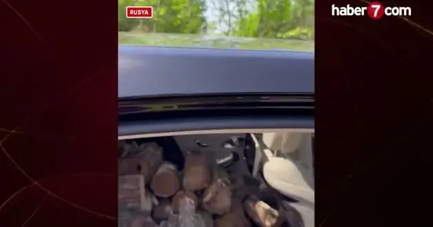 Rusya da ilginç görüntü: Lüks otomobiliyle odun taşıdı